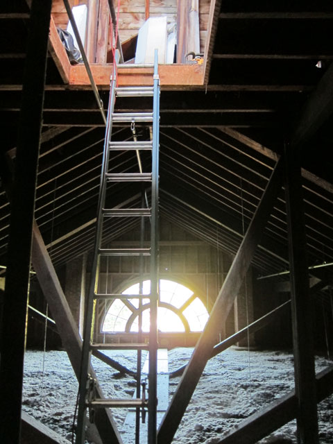 Ladder from attic space above the second floor theater to the cupola opening.