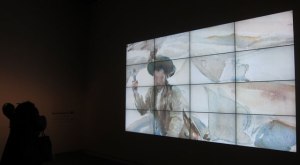 At the entrance, a large rotating projection