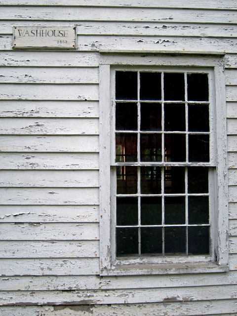 The unrestored "wash house."