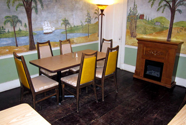 Shame on those chairs and the faux fireplace. But the murals are wonderful, and valuable.