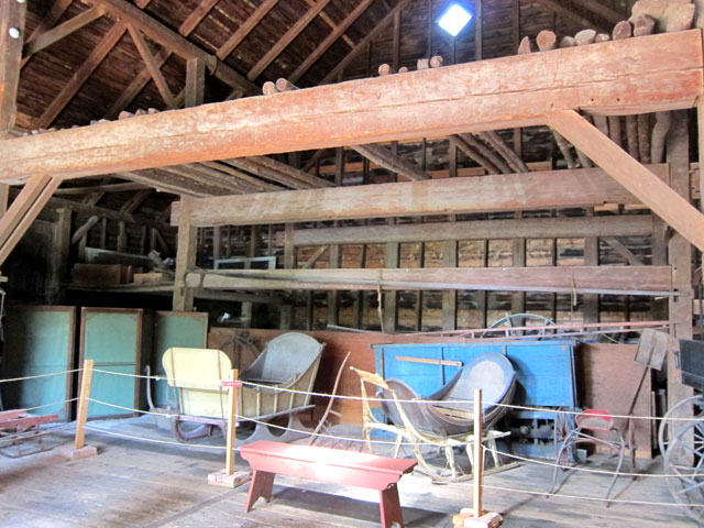 Dutch Barn (with exhibits) at The Bronck Museum. Note massive H patter supporting beam structure.