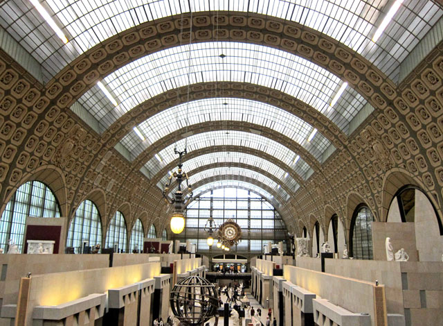 The grand entrance hall (former railroad shed) of Musee d'Orsay.